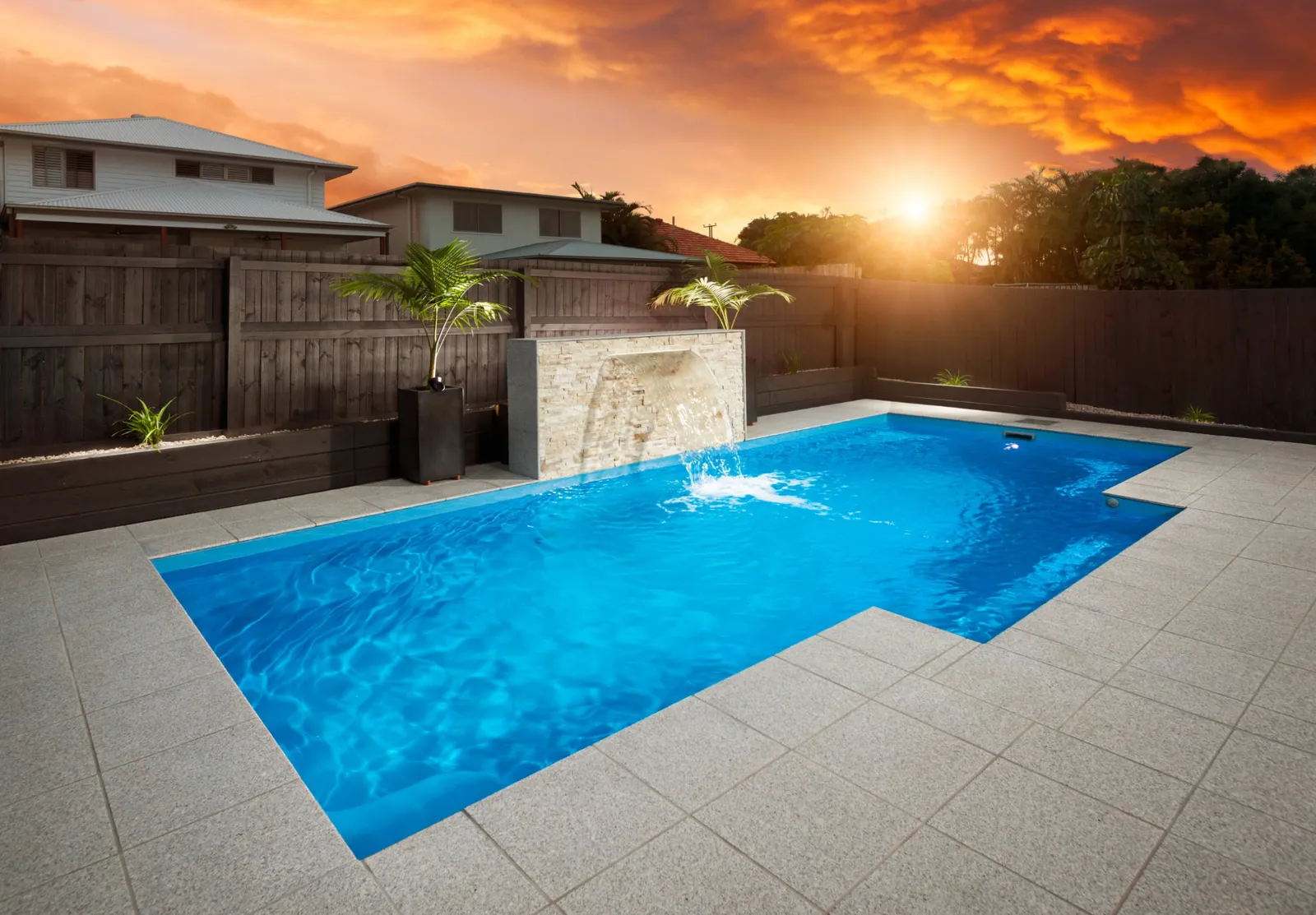 Vice President 8m fibreglass pool with paved surrounds and water feature