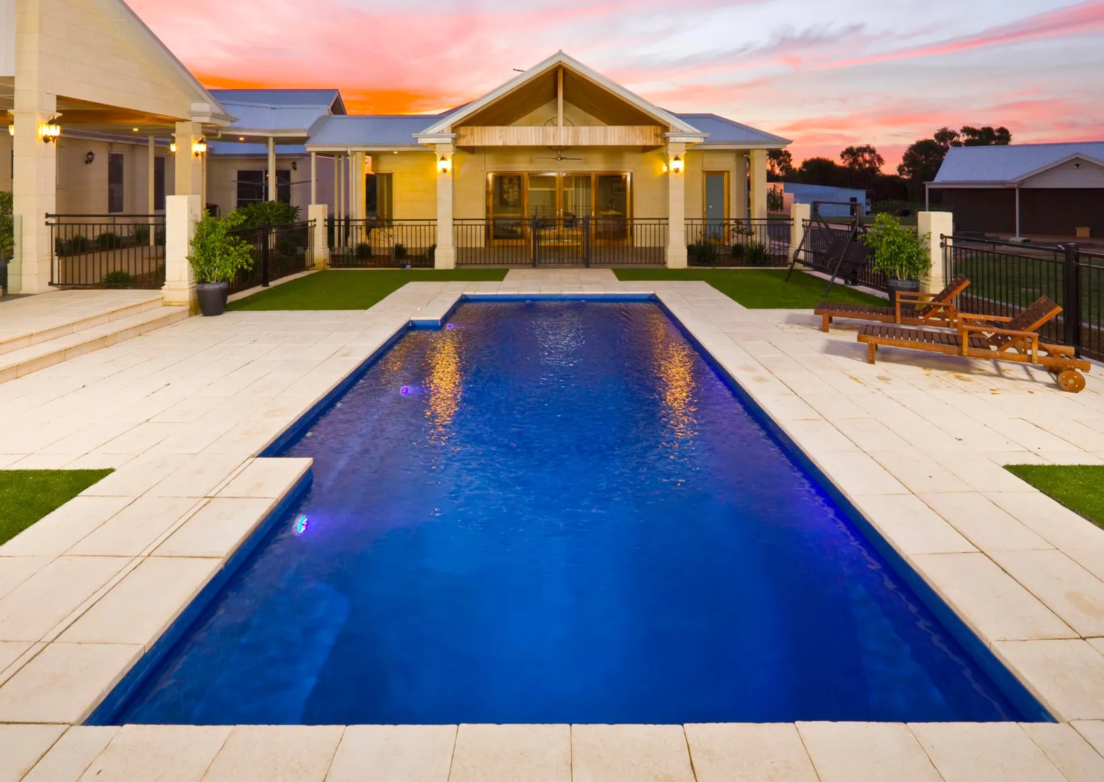 Ambassador 6m rectangular fibreglass pool with paved surrounds