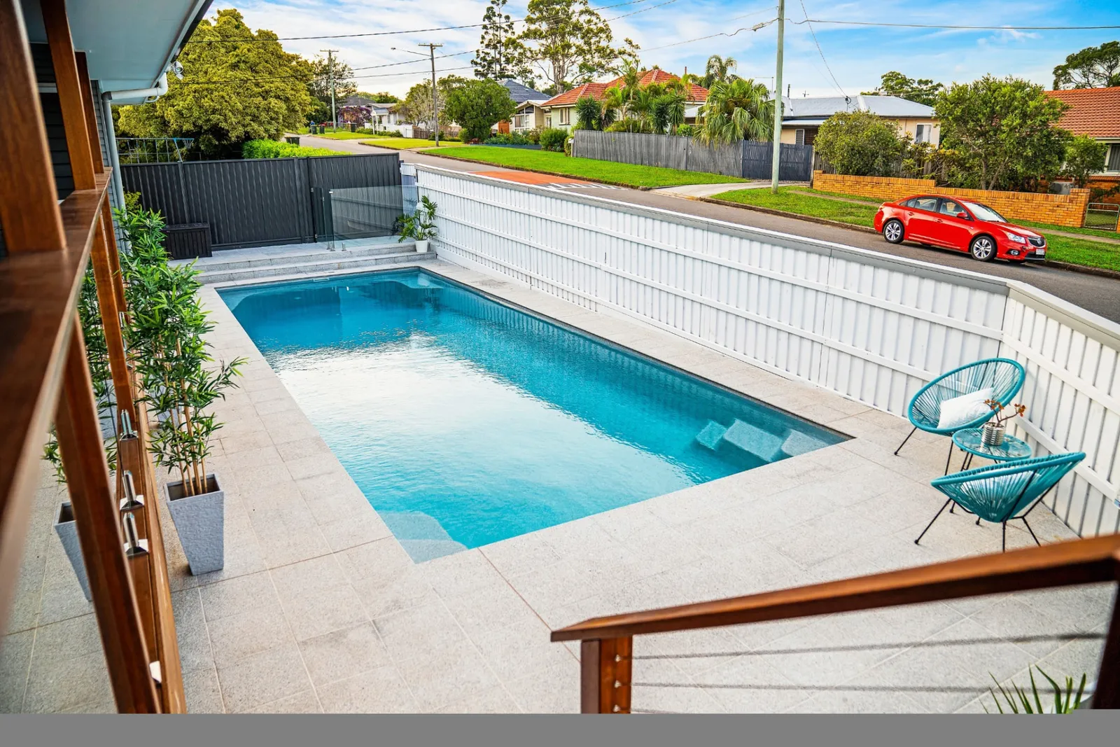 Platinum 6m fibreglass pool with entry steps and paved surrounds