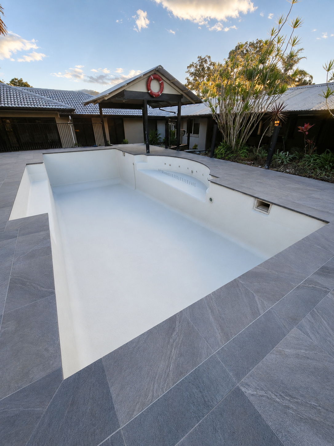 9m x 5m pool during resurfacing, stripped pebblecrete and new coping, New Beith