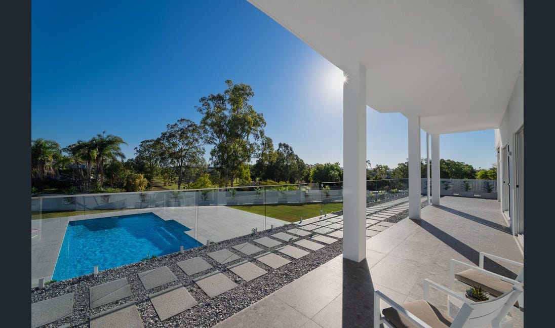 Pool with glass fencing and stepping stone pathway