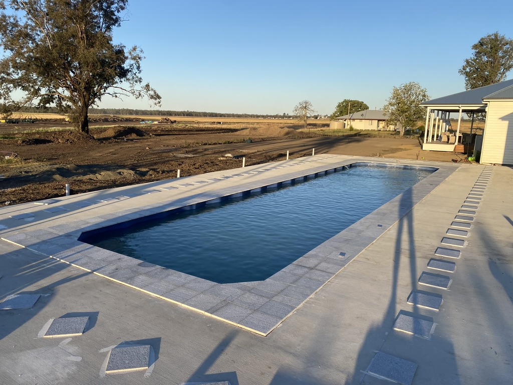 Large fibreglass pool with concrete surround rural property