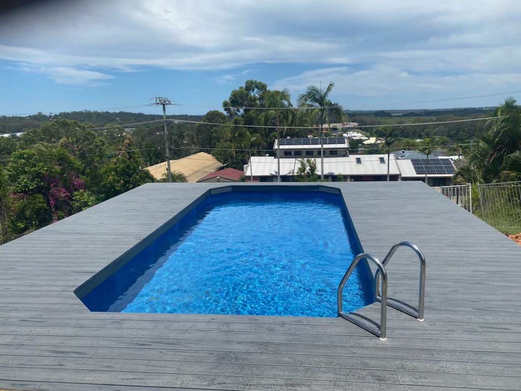 Above ground pool with timber decking and scenic views